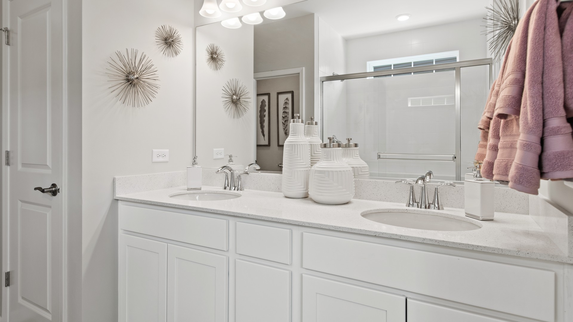 Owner’s bathroom features a double bowl vanity and walk-in shower